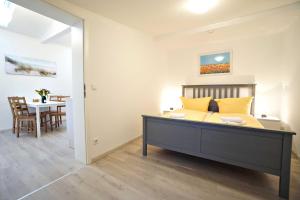 Ein Bett oder Betten in einem Zimmer der Unterkunft Haus Vilma