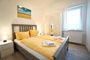 Ein Bett oder Betten in einem Zimmer der Unterkunft Haus Vilma