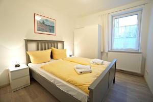Ein Bett oder Betten in einem Zimmer der Unterkunft Haus Vilma