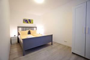 Ein Bett oder Betten in einem Zimmer der Unterkunft Haus Vilma