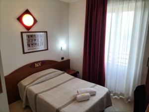 Voodi või voodid majutusasutuse Hotel Della Volta toas