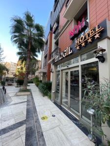 a building with a sign for a hotel at Giritligil Hotel in Manisa