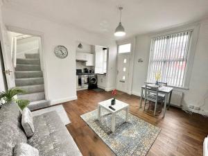 a living room with a couch and a table at (S17) Convenient 2BR Leeds - Sleeps 4 in Leeds