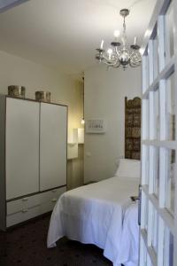 A bed or beds in a room at Ciudad Jardín Marina
