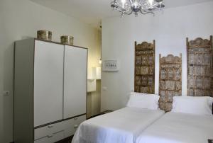 A bed or beds in a room at Ciudad Jardín Marina