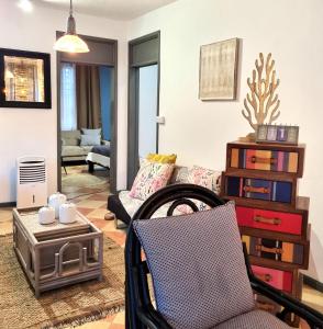 a living room with a couch and a chair at Cside Escape Villa in Rivière Noire