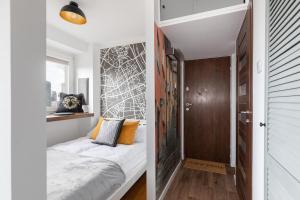 Posteľ alebo postele v izbe v ubytovaní Chmielna 35 - City View Apartment by Noclegi Renters