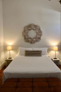 A bed or beds in a room at Ciudad Jardín Marina
