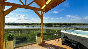 a view from the deck of a house with a swimming pool at Bulwar Residence & Wellness in Kazimierz Dolny +48 photos