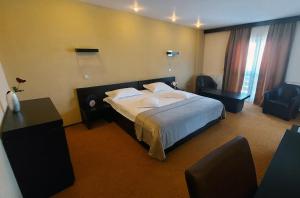 Postel nebo postele na pokoji v ubytování C&C Karo Resort
