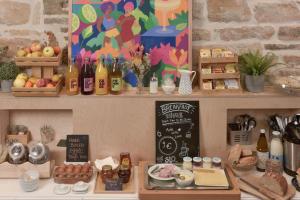 a kitchen with a counter with food and a chalkboard at SLO Hostel Lyon Saxe in Lyon +36 photos