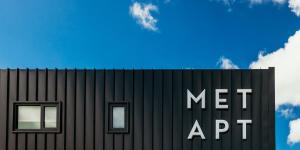 a black building with two windows and a net app sign at Met Apartments in Port Lincoln