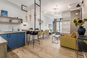 Kuchyňa alebo kuchynka v ubytovaní Apartamenty DEO PLAZA by Rent like home