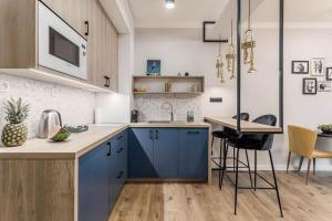 Kuchyňa alebo kuchynka v ubytovaní Apartamenty DEO PLAZA by Rent like home