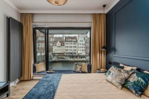 Posteľ alebo postele v izbe v ubytovaní Apartamenty DEO PLAZA by Rent like home