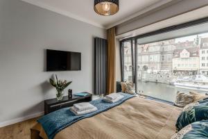 Posteľ alebo postele v izbe v ubytovaní Apartamenty DEO PLAZA by Rent like home