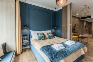 Posteľ alebo postele v izbe v ubytovaní Apartamenty DEO PLAZA by Rent like home