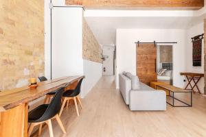 a kitchen and living room with a table and chairs at PR27 in Valencia