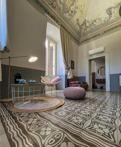 Uma área de estar em B&B Palazzo 1906 - Eco dimora storica