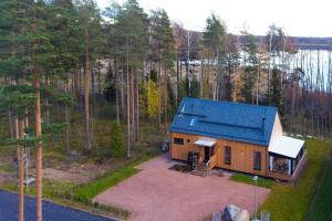 an overhead view of a house with a blue roof at Villa Pickala - Design - Seafront - Hot tub in Helsinki