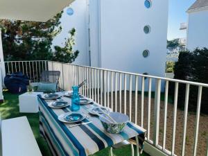 a table on the back porch of a house at L'Hallali à la Baule centre in La Baule