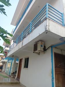 a balcony on the side of a building at Sai Leela Guest House in Dabolim