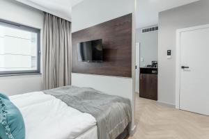 Posteľ alebo postele v izbe v ubytovaní Apartamenty DEO PLAZA by Rent like home