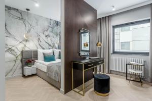 Posteľ alebo postele v izbe v ubytovaní Apartamenty DEO PLAZA by Rent like home