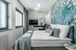 Posteľ alebo postele v izbe v ubytovaní Apartamenty DEO PLAZA by Rent like home