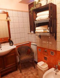 a bathroom with a sink and a toilet and a mirror at B&B Mannalà in Agrigento