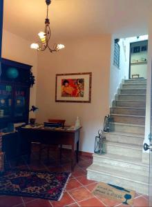 a room with a piano and stairs in a house at B&B Mannalà in Agrigento