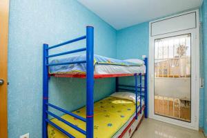 a bunk bed room with two bunk beds in it at 106casa bocana inmo apartaments roses in Roses