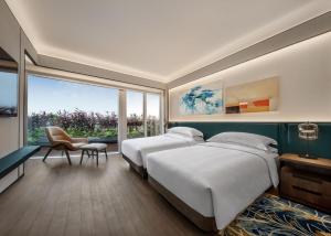 Voodi või voodid majutusasutuse Andaz Macau, By Hyatt toas