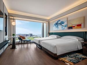 Voodi või voodid majutusasutuse Andaz Macau, By Hyatt toas