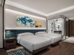 Voodi või voodid majutusasutuse Andaz Macau, By Hyatt toas