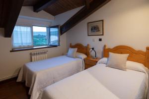 A bed or beds in a room at Posada La Olma