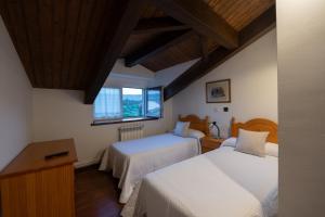 A bed or beds in a room at Posada La Olma