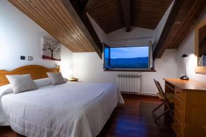 A bed or beds in a room at Posada La Olma