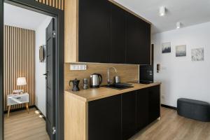 Kuchyňa alebo kuchynka v ubytovaní Rent like home - Piaseckiego 24