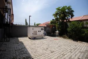 an appliance is sitting on a brick patio at Home away from Home. in Galadima