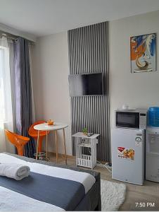 a hotel room with a bed and a small table at Polar homes in Nairobi
