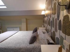 מיטה או מיטות בחדר ב-Le Cerf volant