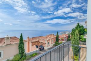 a view from the balcony of a house at Villa Gasparini Palheiro Village by Holiday Rental Madeira in São Gonçalo