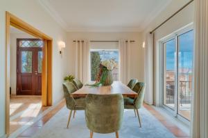 a dining room with a table and chairs at Villa Gasparini Palheiro Village by Holiday Rental Madeira in Funchal