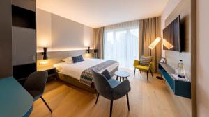 Giường trong phòng chung tại Best Western Plus Parkhotel Maximilian Ottobeuren +157 ảnh