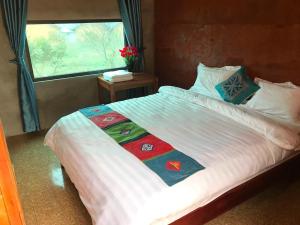 Giường trong phòng chung tại Homestay Lý Tà Thí