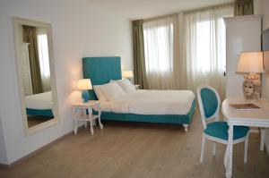 Postel nebo postele na pokoji v ubytování Villa Quisisana Taormina