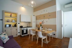 a kitchen and dining room with a table and chairs at [Entire Villa] Lakes & Borromean Islands in Sesto Calende +38 photos