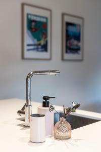 a bathroom counter with a sink with a faucet at La Ruinette - Modern 2 Bed, Close To The Lift in Le Châble
