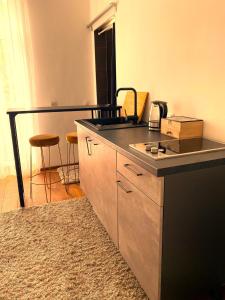 a kitchen with a counter and a counter top at Free Parking - Premium Bed - Modern Kitchen 